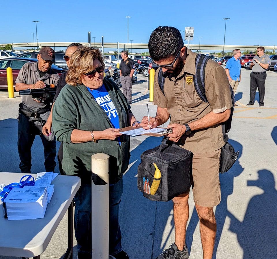 UPS worker fills out registration form